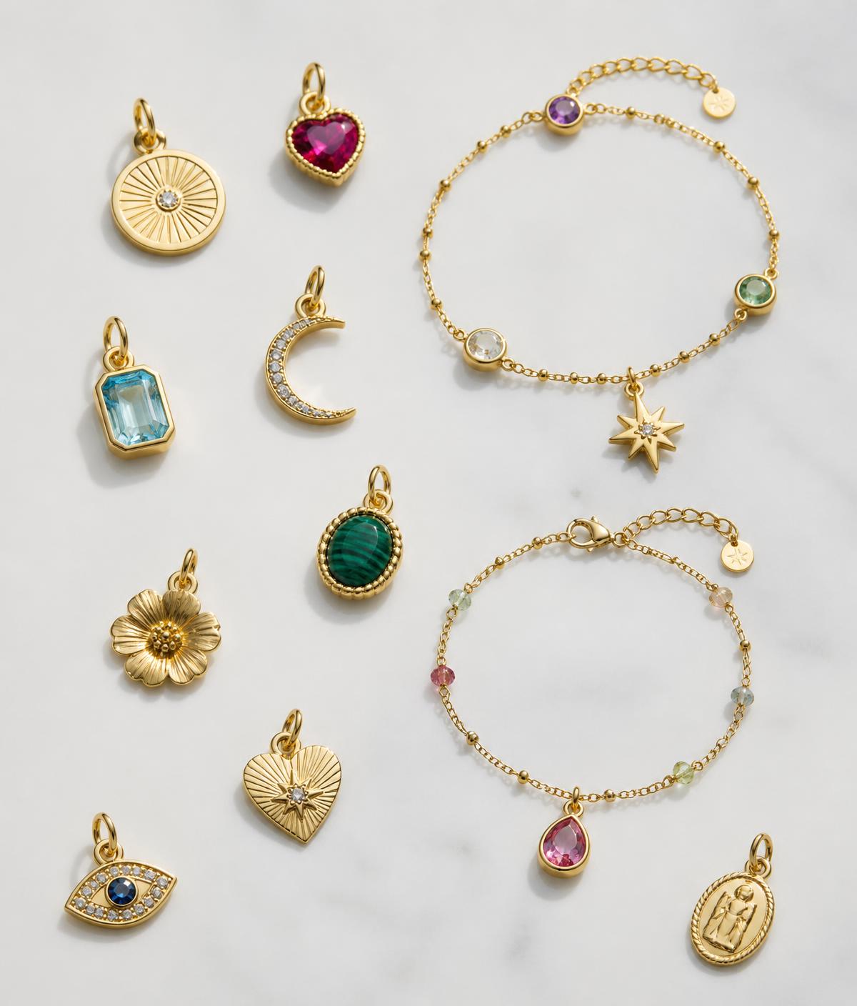 Gold charm pendants and fine chain bracelets
